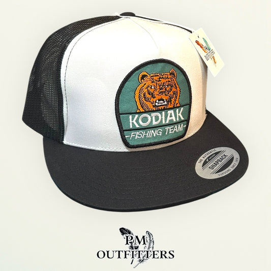 Kodiak Fishing Team Trucker Hat — PM Outfitters Heritage Patch | Yupoong Flat Bill White Black Alaska Wilderness