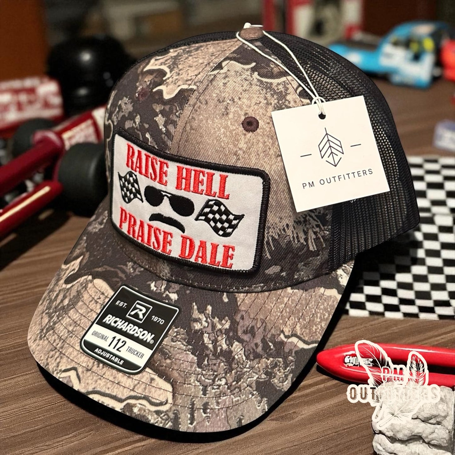 Raise Hell Praise Dale Retro NASCAR Camo Trucker Hat