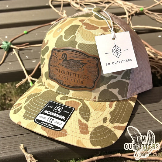 PM Outfitters Hunt Club duck patch trucker hat with centered patch placement