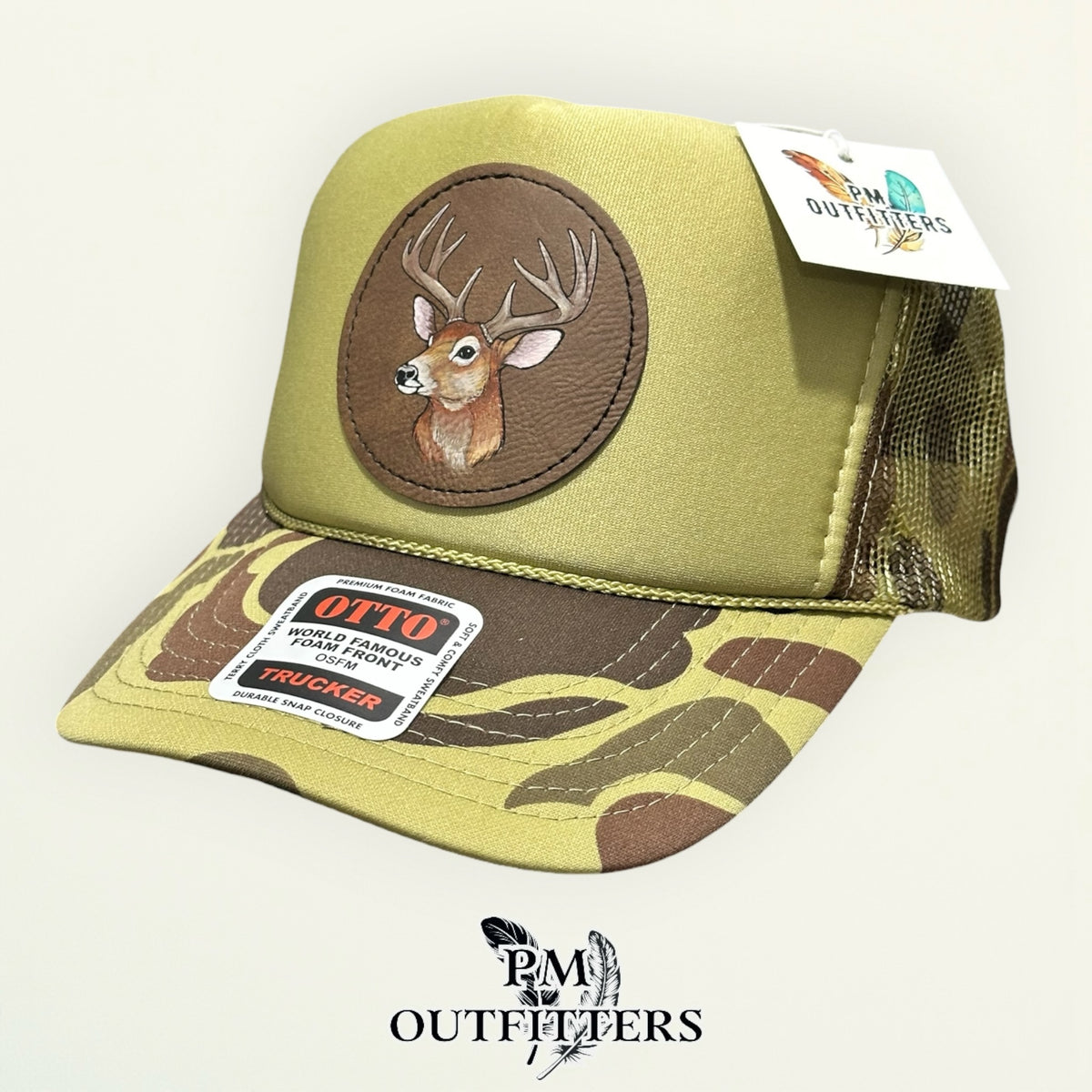 Olive green and camo Otto foam front trucker hat with hand-painted deer head patch, PM Outfitters True Originals