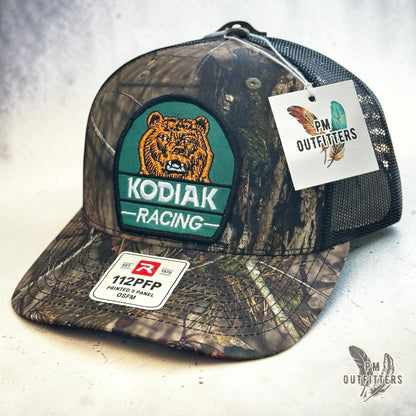 Kodiak Racing Trucker Hat – PM Outfitters Bear Patch | Richardson 112 Mossy Oak Country DNA Camo