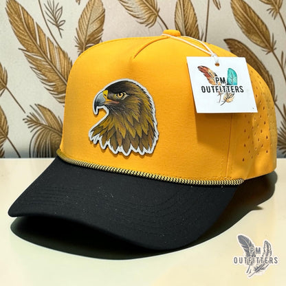 Hand-painted Southern Miss Golden Eagle patch on a black and gold Dallas 804 performance rope cap, PM Outfitters True Originals