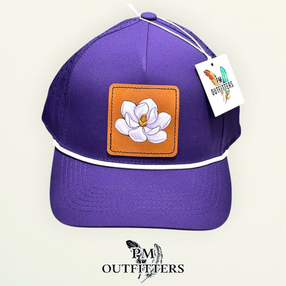 Close-up of the hand-painted magnolia patch showing brushwork detail, PM Outfitters True Originals