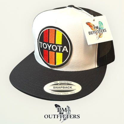 Toyota Retro Stripes Trucker Hat — PM Outfitters Racing Patch | Yupoong Flat Bill White Black Motorsports Heritage