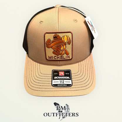 Michelin Man Trucker Hat — Retro Embroidered Patch | Richardson 112 Khaki Brown