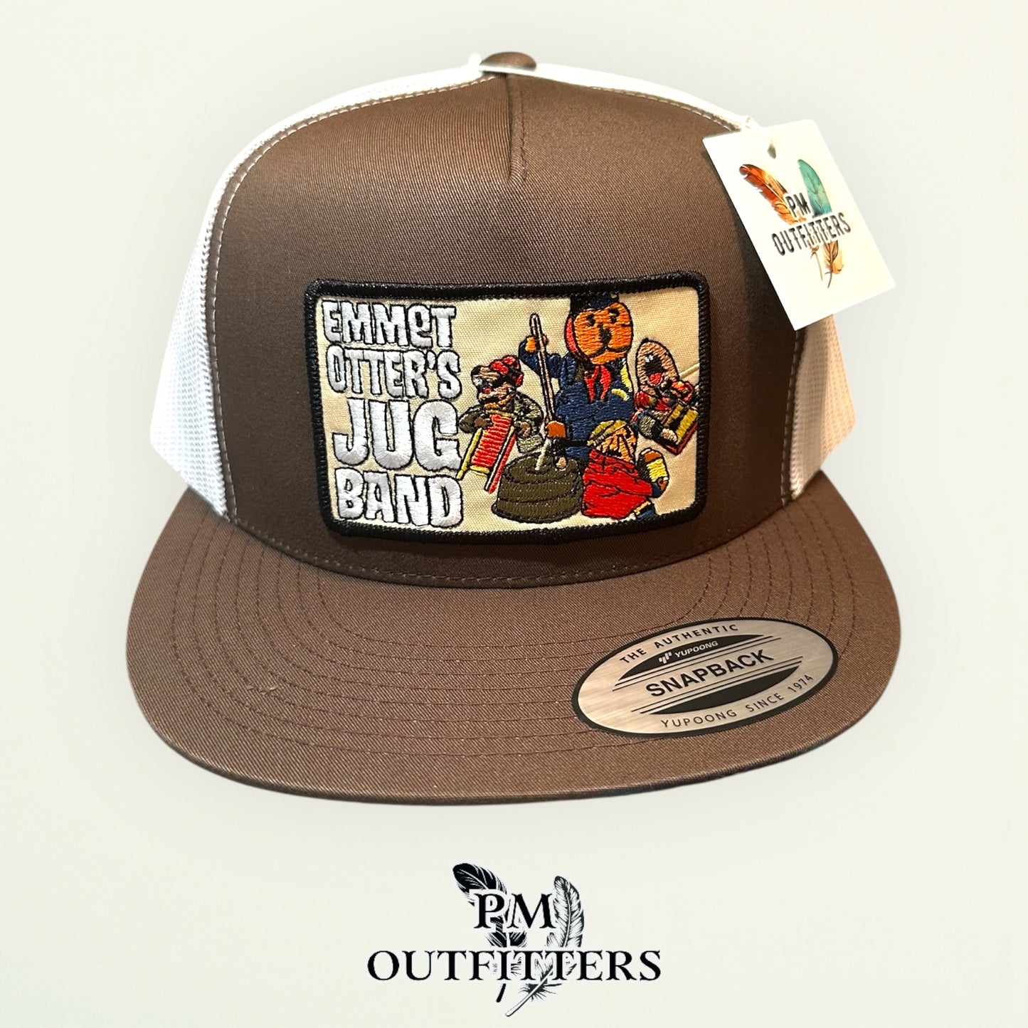 Emmet Otter's Jug Band Trucker Hat — PM Outfitters Retro Patch | Yupoong Flat Bill Brown White Jim Henson Heritage