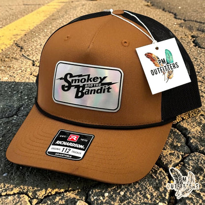 PM Outfitters Smokey and the Bandit trucker hat caramel black Richardson 112 rope holographic patch