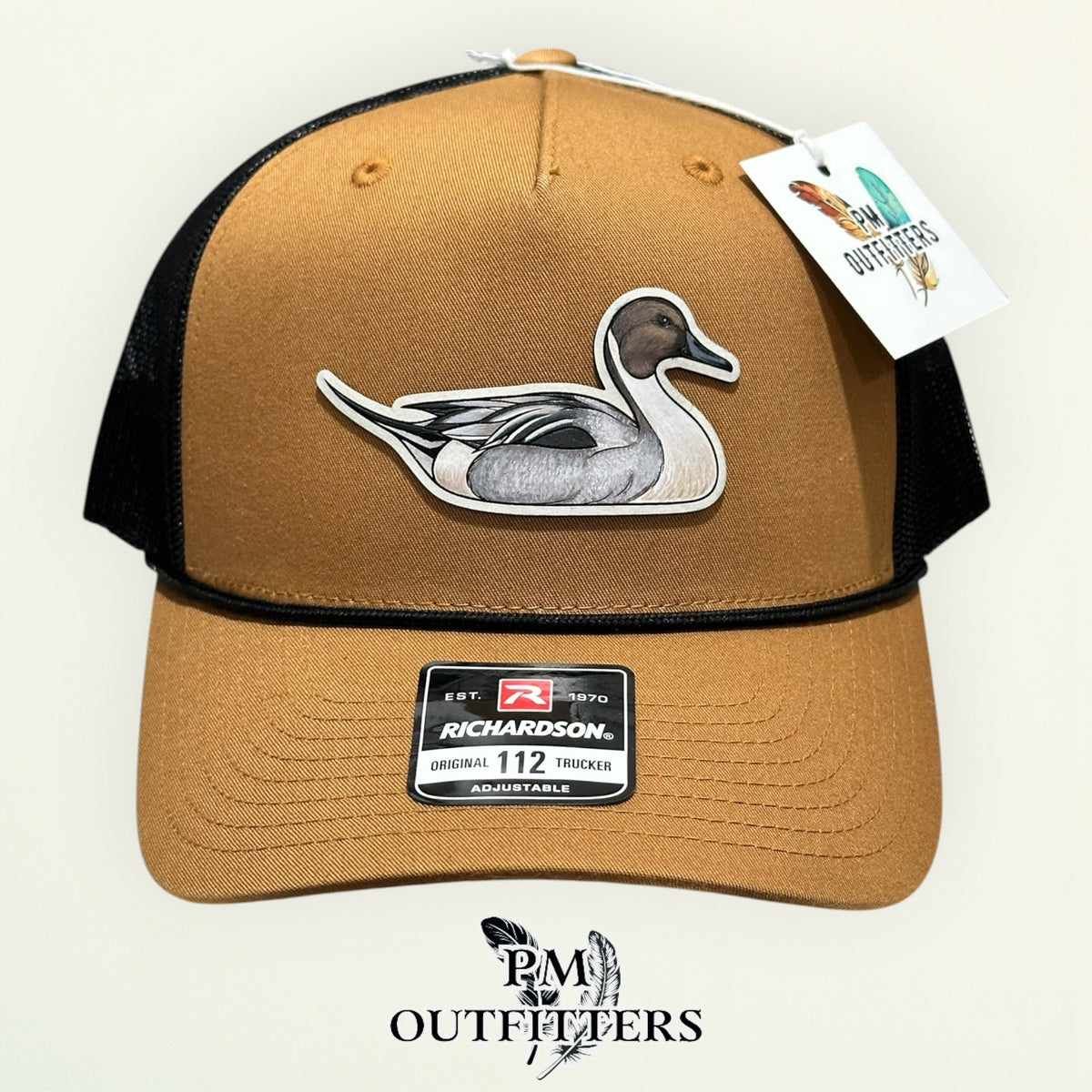 Close-up of the hand-painted Northern Pintail patch showing brushwork detail, PM Outfitters True Originals