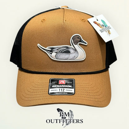 Close-up of the hand-painted Northern Pintail patch showing brushwork detail, PM Outfitters True Originals