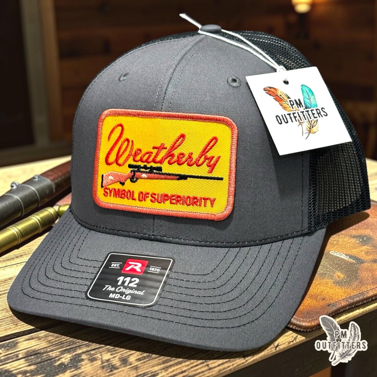 PM Outfitters Weatherby Symbol of Superiority trucker hat charcoal black Richardson 112 rifle patch