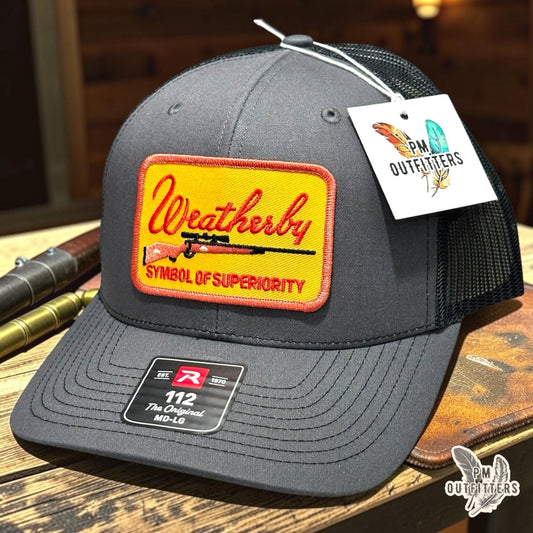 PM Outfitters Weatherby Symbol of Superiority trucker hat charcoal black Richardson 112 rifle patch