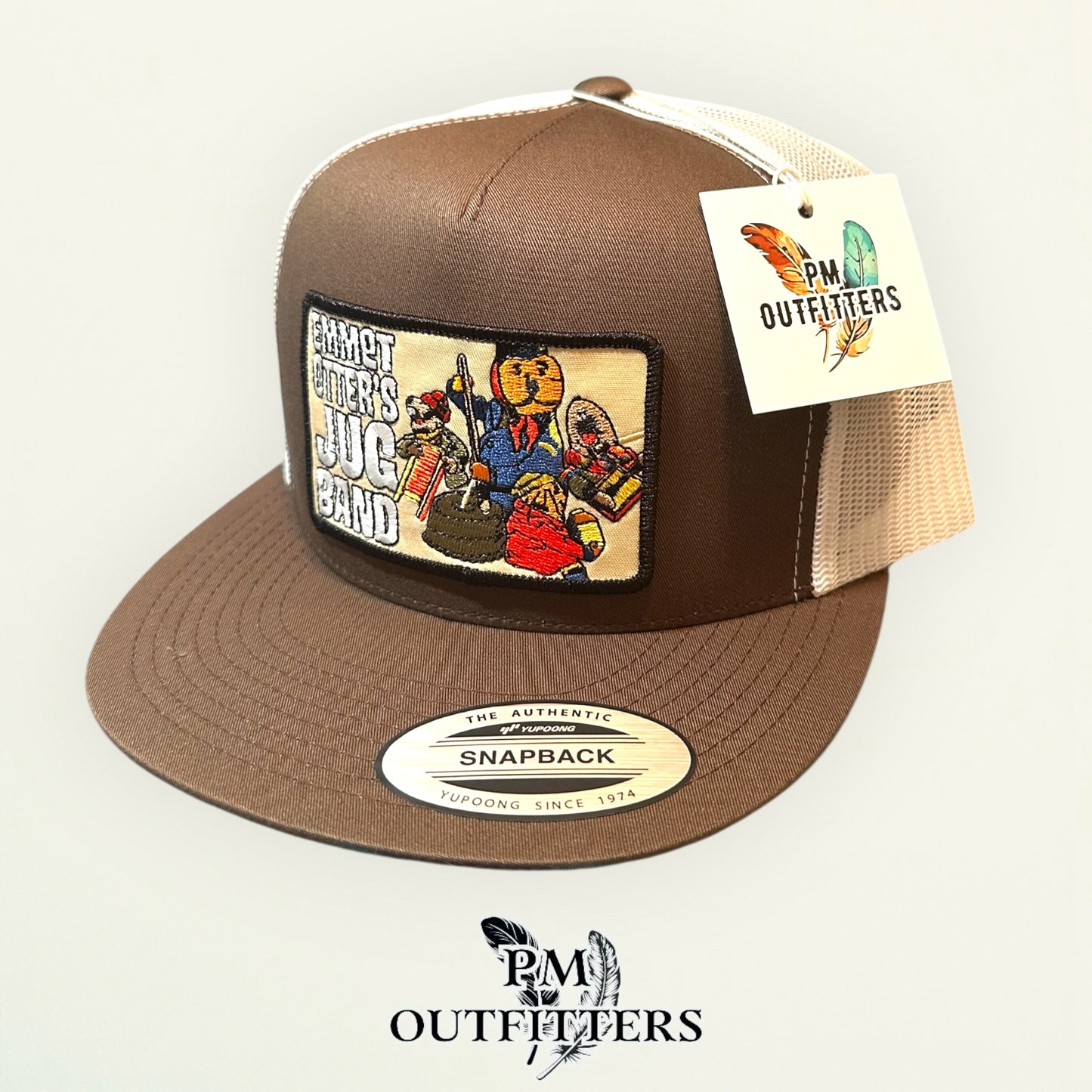 Emmet Otter's Jug Band Trucker Hat — PM Outfitters Retro Patch | Yupoong Flat Bill Brown White Jim Henson Heritage