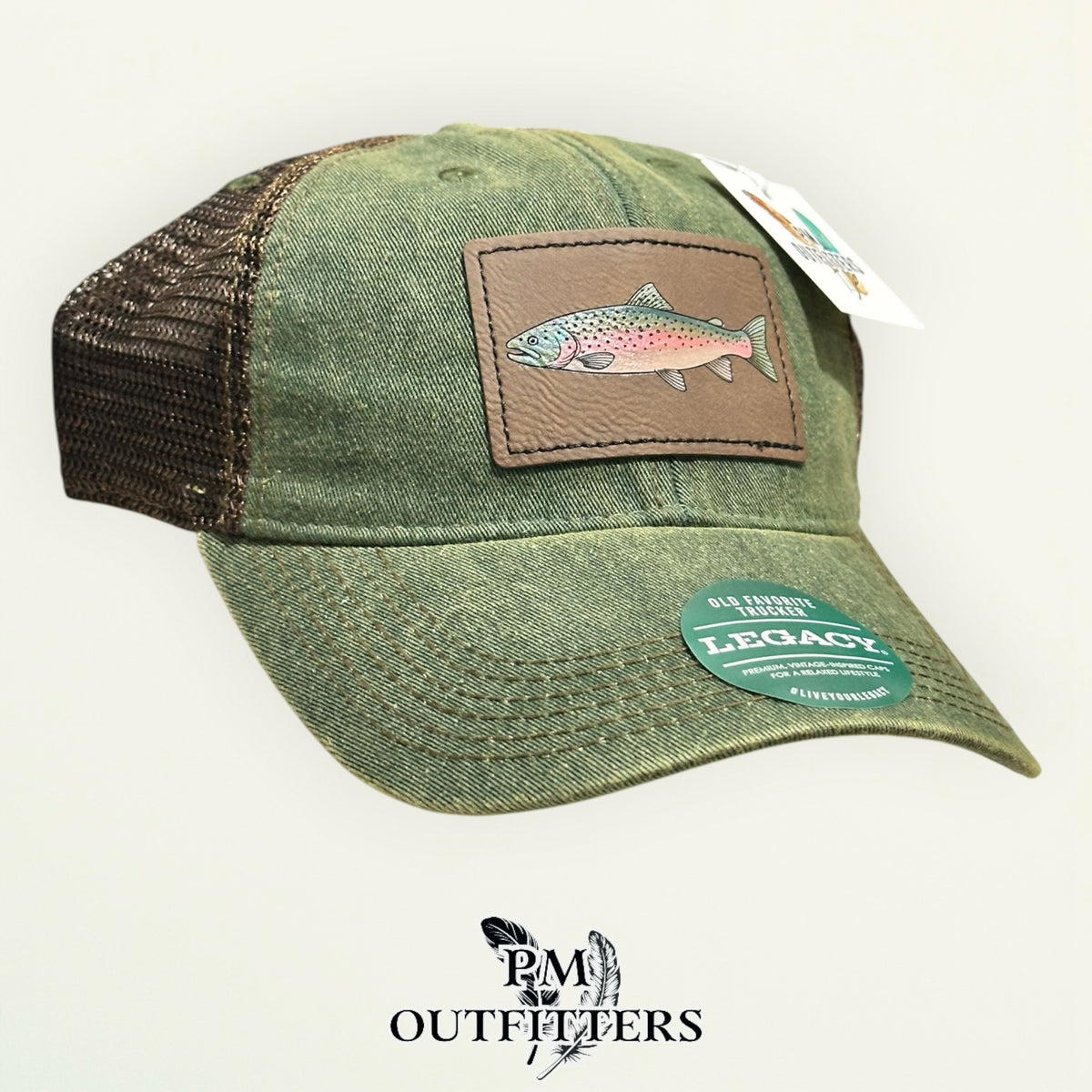 Hand-painted rainbow trout patch on an olive Legacy Old Favorite trucker hat with bronze mesh back, PM Outfitters True Originals