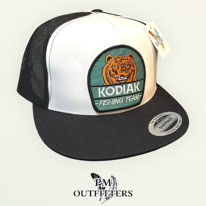 Kodiak Fishing Team Trucker Hat — PM Outfitters Heritage Patch | Yupoong Flat Bill White Black Alaska Wilderness