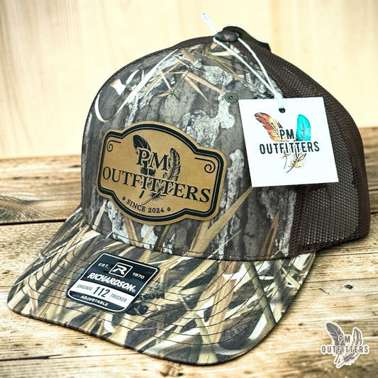PM Outfitters signature logo trucker hat Mossy Oak Habitat camo Richardson 112 vegan leather patch