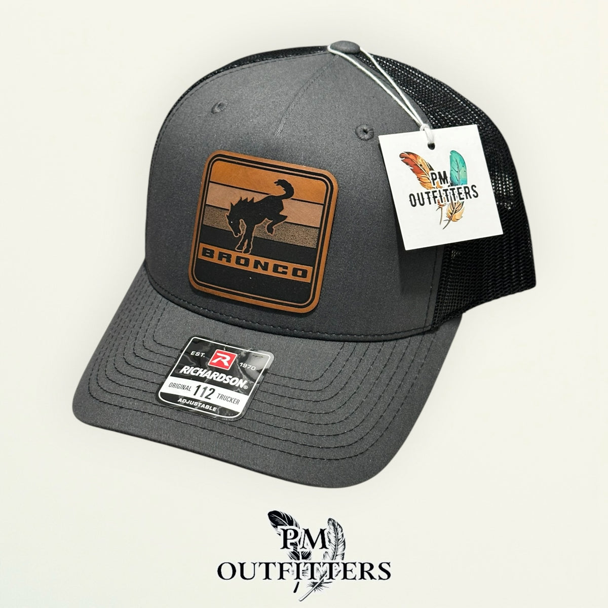 PM Outfitters hang tag Bronco charcoal black trucker hat