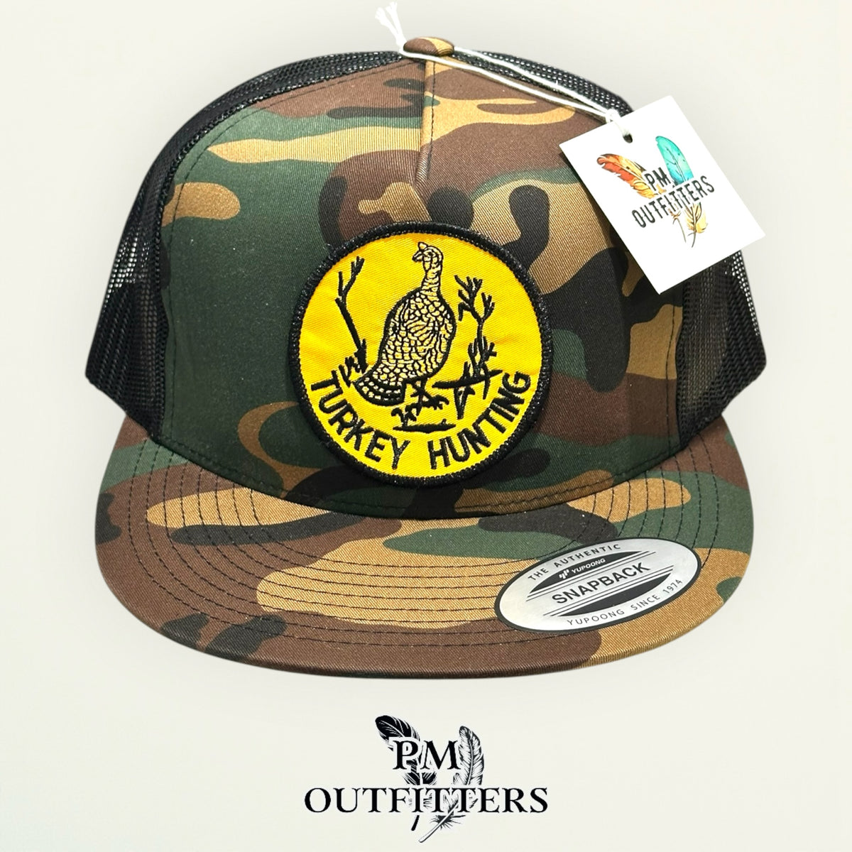 Side view of the Turkey Hunting trucker hat, woodland camo and black mesh