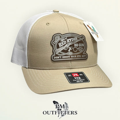 Red Ryder BB Gun trucker hat profile view tan front white mesh