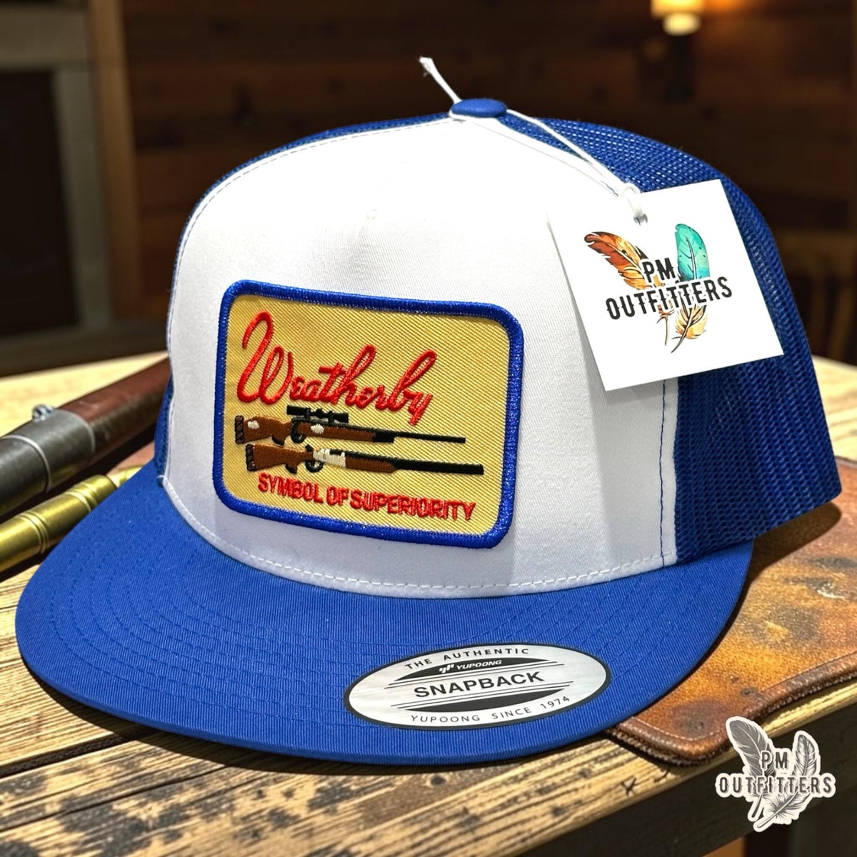 PM Outfitters Weatherby Symbol of Superiority trucker hat white blue YP Classics flat bill two rifle patch