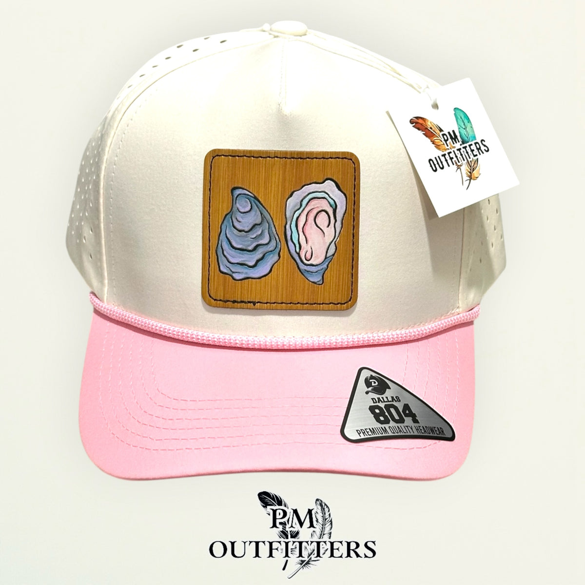 Hand-painted Gulf oyster patch on a cream and pink Dallas 804 waterproof rope trucker hat, PM Outfitters True Originals