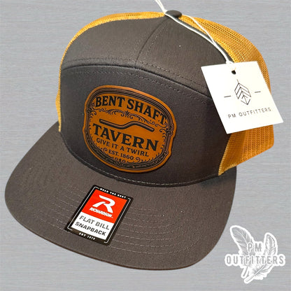 Bent Shaft Tavern Trucker Hat - Custom Leatherette Patch Richardson 168 | Grey Gold Flat Bill Humor Cap