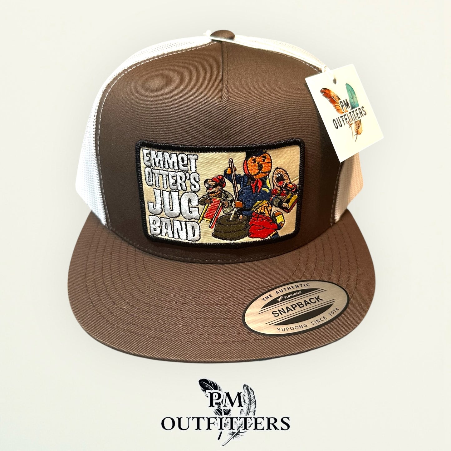 Emmet Otter's Jug Band Trucker Hat — PM Outfitters Retro Patch | Yupoong Flat Bill Brown White Jim Henson Heritage