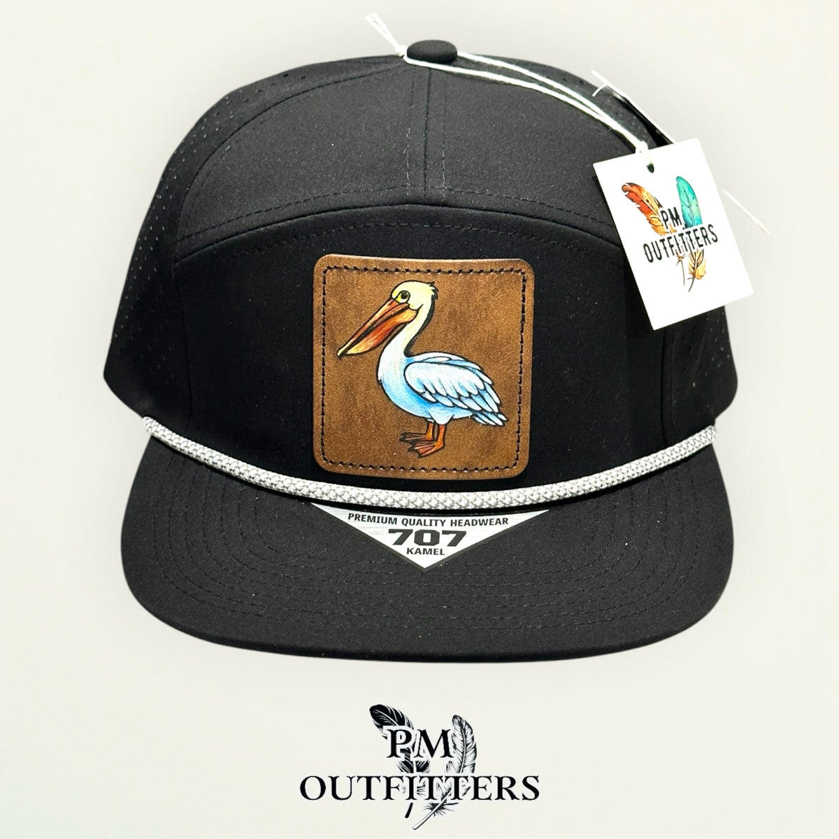 Close-up of the hand-painted white pelican patch showing brushwork detail, PM Outfitters True Originals