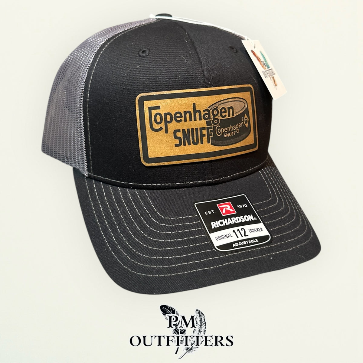 Copenhagen Snuff trucker hat profile view black front charcoal mesh