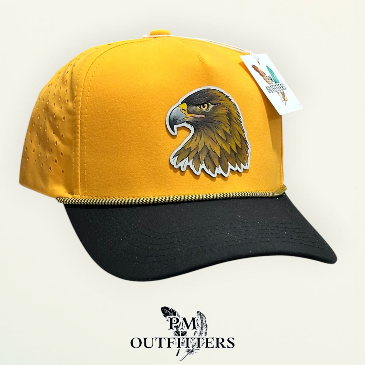 Black and gold Dallas 804 performance rope cap with hand-painted Golden Eagle patch, angled view, PM Outfitters True Originals