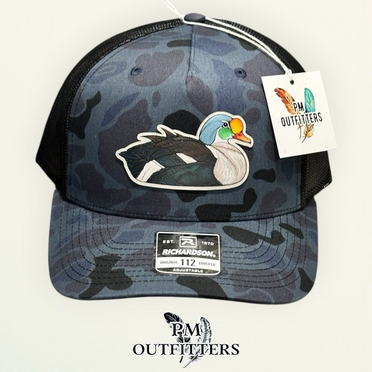 Close-up of the hand-painted King Eider patch showing brushwork detail, PM Outfitters True Originals