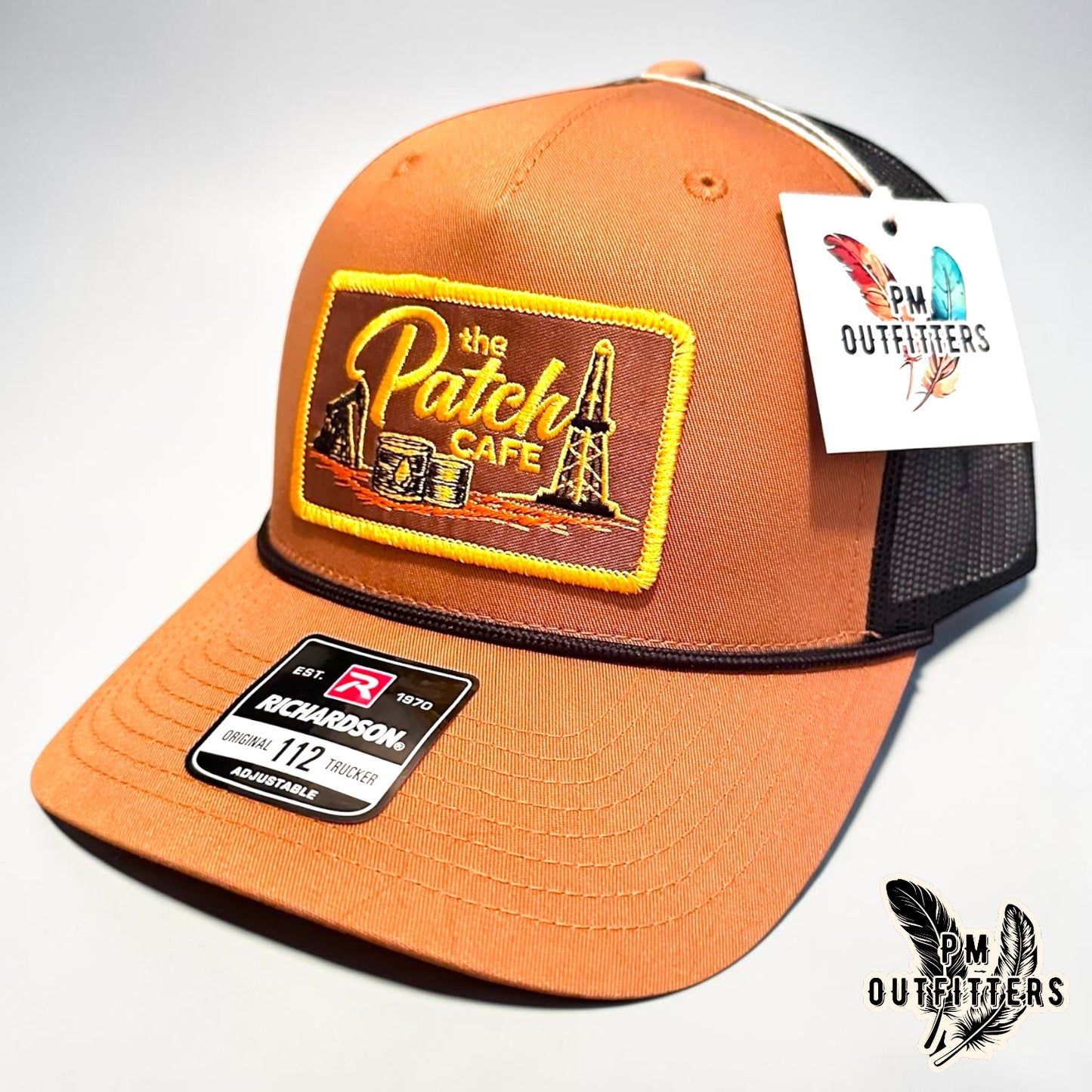 The Patch Cafe Oilfield Trucker Hat | Richardson 112 Rope | Caramel Black | Landman Hat