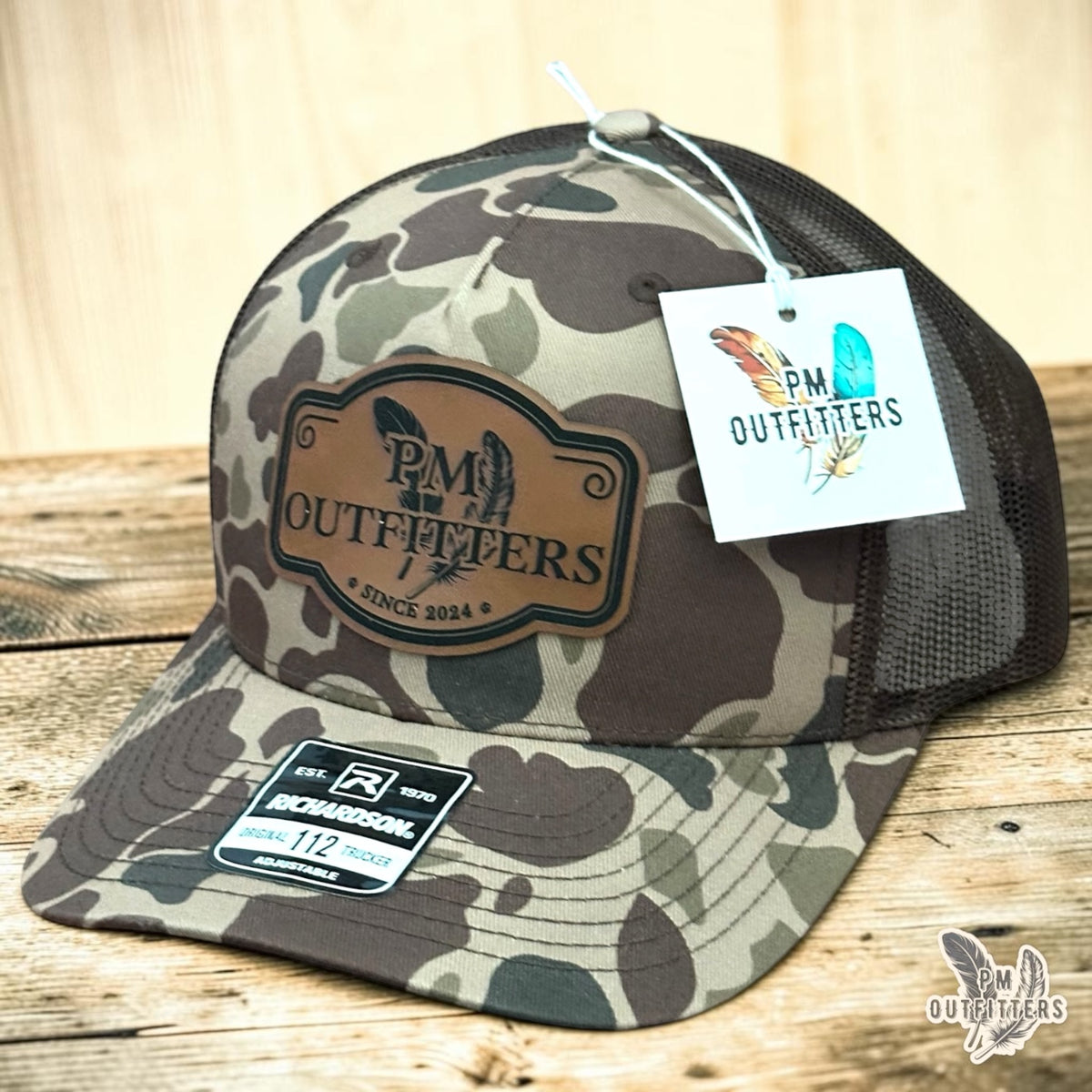 PM Outfitters signature logo trucker hat Bark Duck camo Richardson 112 vegan leather patch