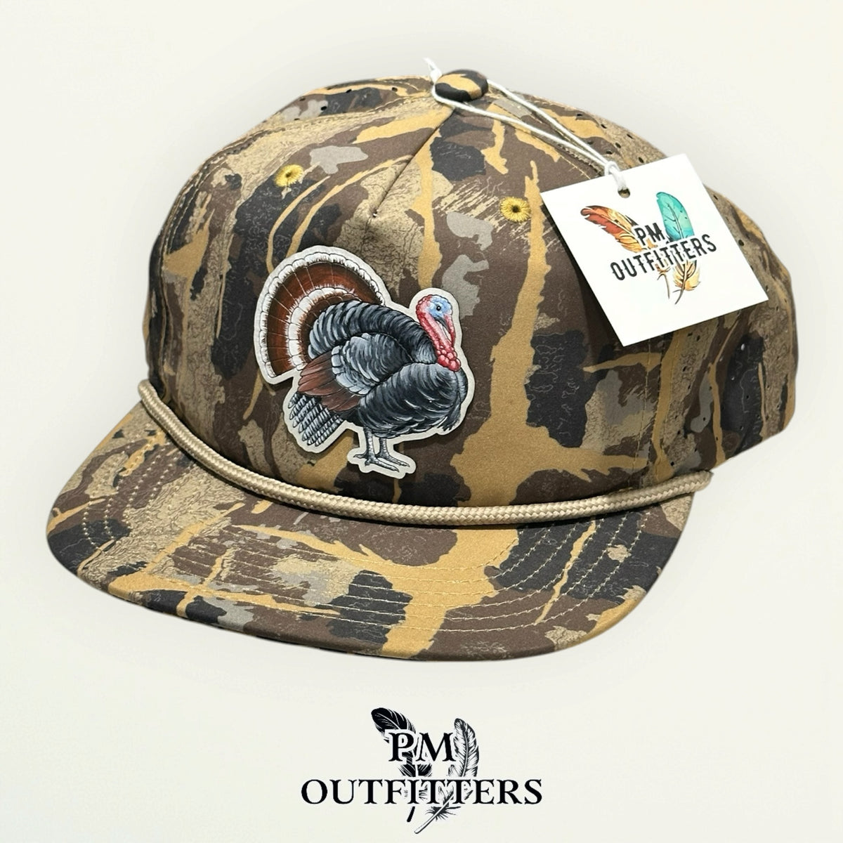Hand-painted wild turkey rope hat in HuntLand camo with PM Outfitters hang tag