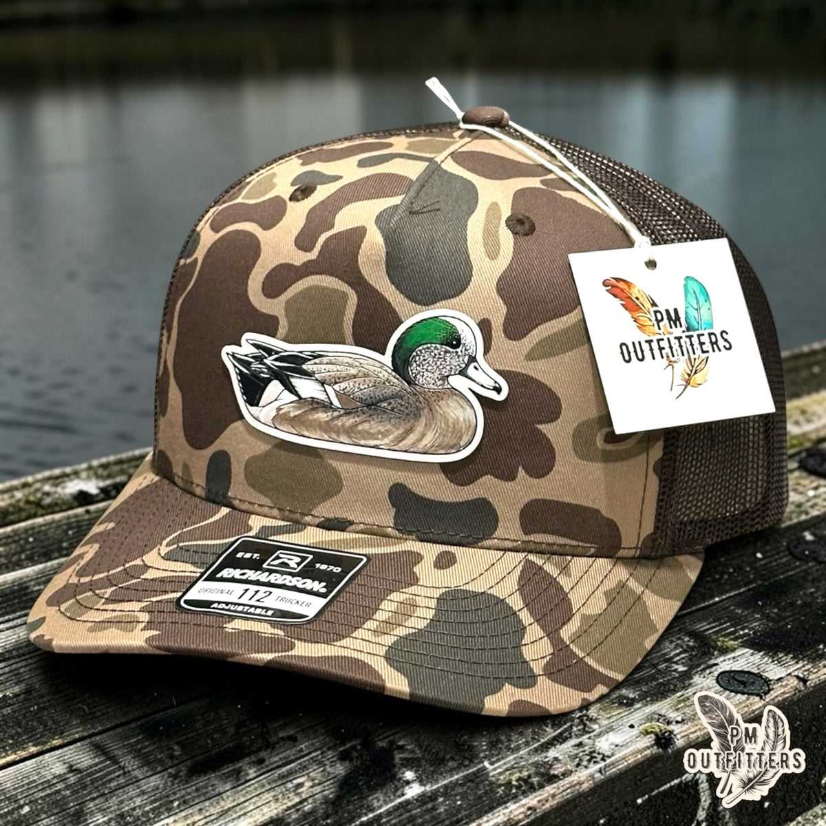 Hand-painted American Wigeon patch on a Richardson 112PFP Bark duck camo trucker hat, PM Outfitters True Originals