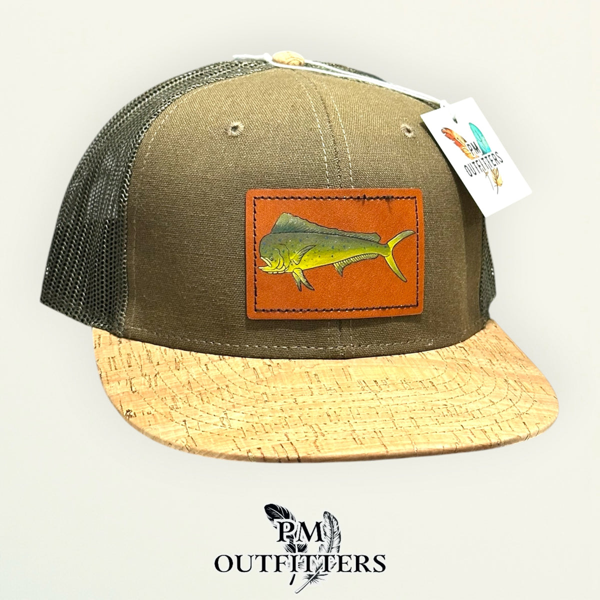 Hand-painted mahi-mahi patch on an olive Otto 141 cork-bill trucker hat, PM Outfitters True Originals