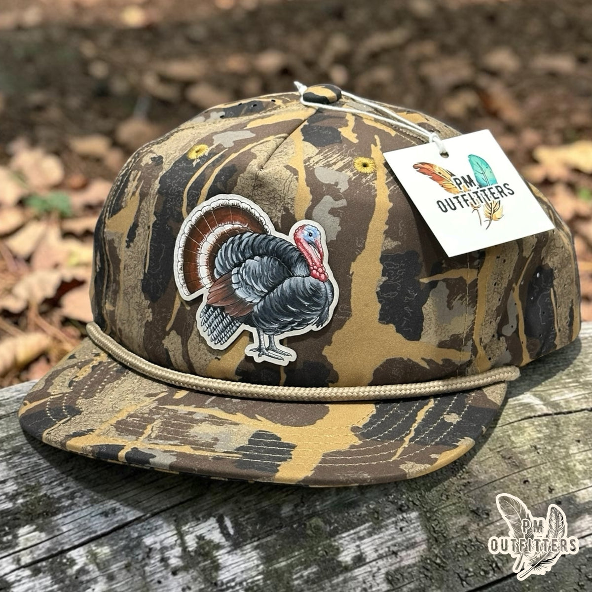 Hand-painted strutting wild turkey patch on a Sobro Marina Pro Perforated rope hat in Burnt Umber HuntLand camo with tan rope, PM Outfitters True Originals