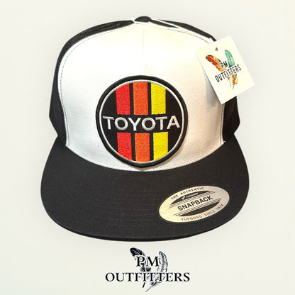 Toyota Retro Stripes Trucker Hat — PM Outfitters Racing Patch | Yupoong Flat Bill White Black Motorsports Heritage