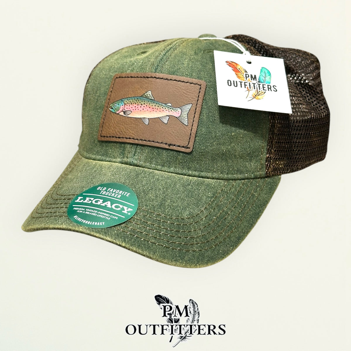Hand-painted rainbow trout patch on an olive Legacy Old Favorite trucker hat with bronze mesh back, PM Outfitters True Originals