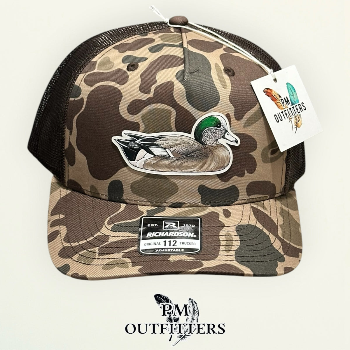 Close-up of the hand-painted American Wigeon patch showing brushwork detail, PM Outfitters True Originals