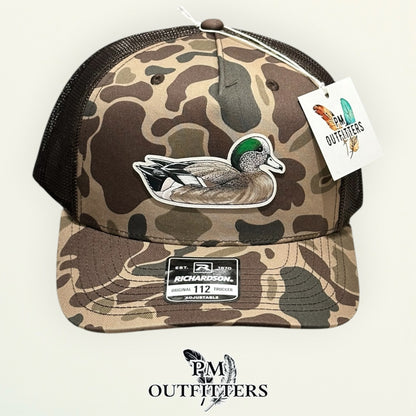 Close-up of the hand-painted American Wigeon patch showing brushwork detail, PM Outfitters True Originals