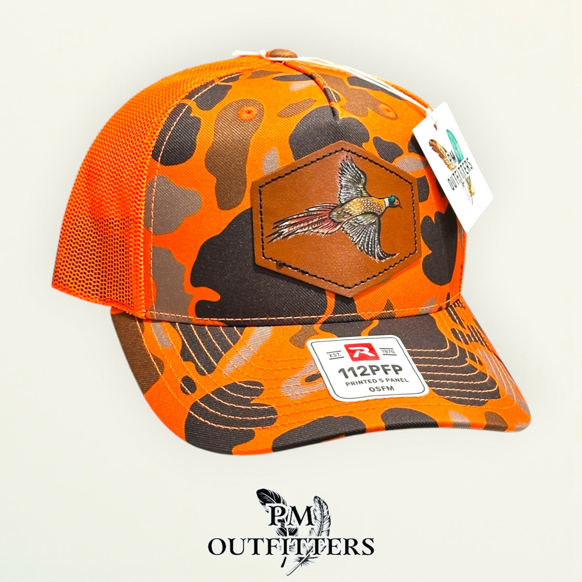 Hand-painted Pheasant patch on a blaze duck camo Richardson 112PFP trucker hat, PM Outfitters True Originals
