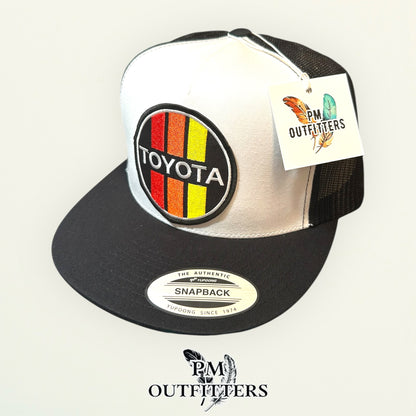 Toyota Retro Stripes Trucker Hat — PM Outfitters Racing Patch | Yupoong Flat Bill White Black Motorsports Heritage