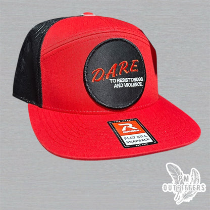 Red and black Richardson 168 7-panel trucker hat with retro DARE embroidered patch, vintage style.