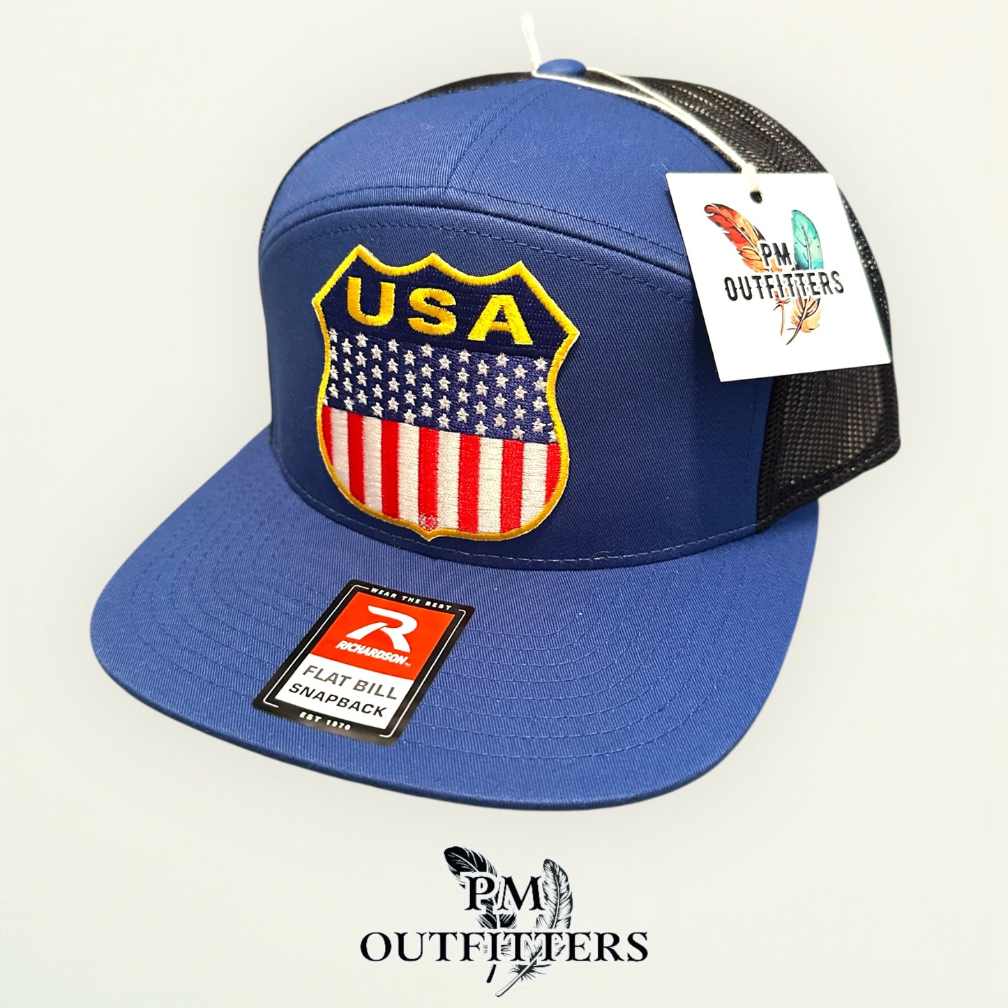 USA Shield Patch Trucker Hat — Retro American Flag Embroidered Patch | Richardson 168 7-Panel Flat Bill Blue Black