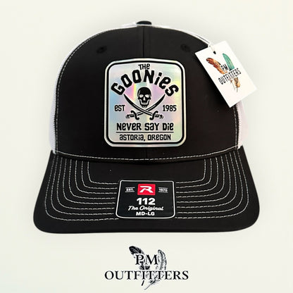 The Goonies Never Say Die Trucker Hat – PM Outfitters Holographic Vegan Leather Patch | Richardson 112 Black White