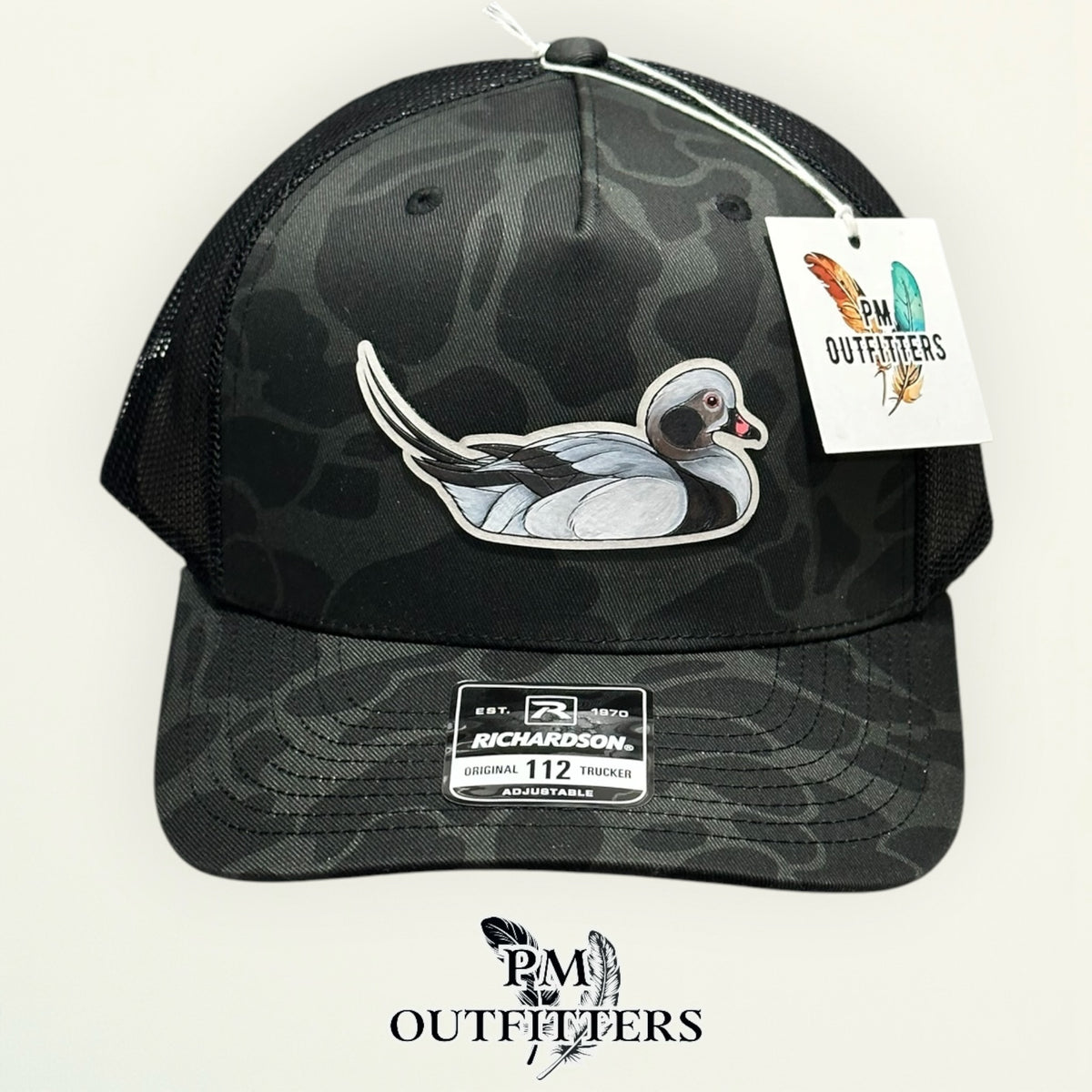 Close-up of the hand-painted Long-Tailed Duck patch showing brushwork detail, PM Outfitters True Originals