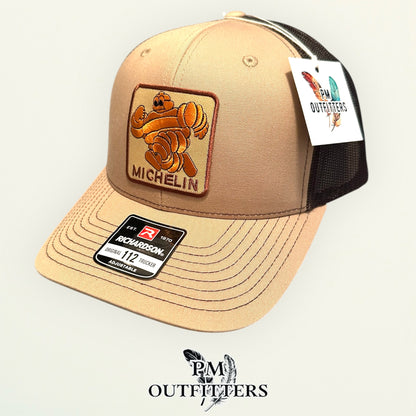 Michelin Man Trucker Hat — Retro Embroidered Patch | Richardson 112 Khaki Brown