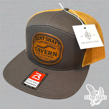 Bent Shaft Tavern Trucker Hat - Custom Leatherette Patch Richardson 168 | Grey Gold Flat Bill Humor Cap