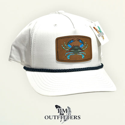 Hand-painted blue crab patch on a white Richardson 258 rope trucker hat with navy trim, PM Outfitters True Originals