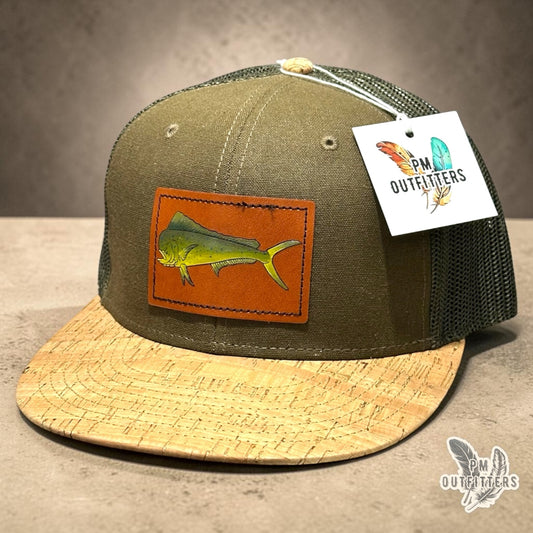 Hand-painted mahi-mahi patch on an olive Otto 141 cork-bill trucker hat, PM Outfitters True Originals